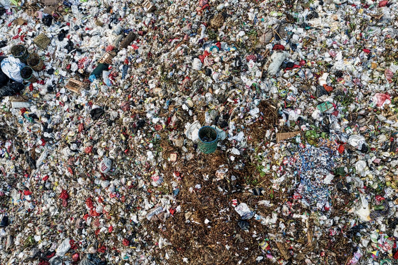 our-story Aerial shot showing extensive environmental pollution at a landfill site.